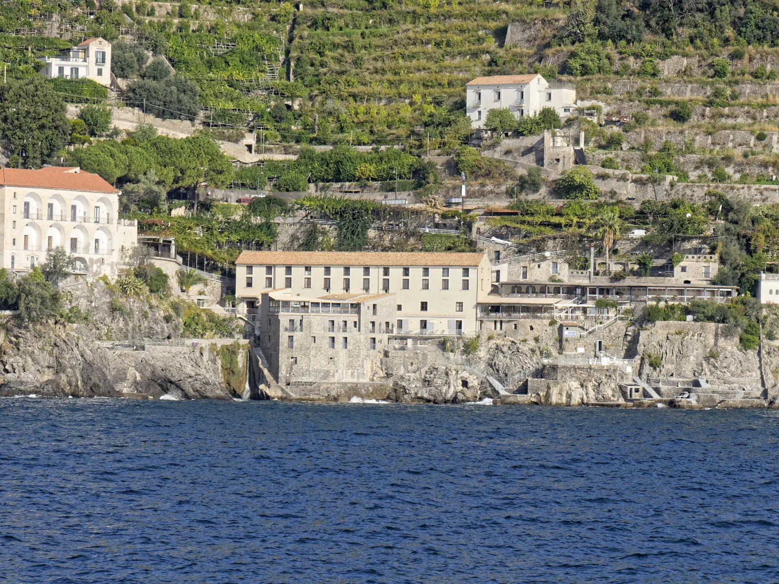 Cliffside hotel with terraced lemon gardens above the sea on the Amalfi Coast, Italy